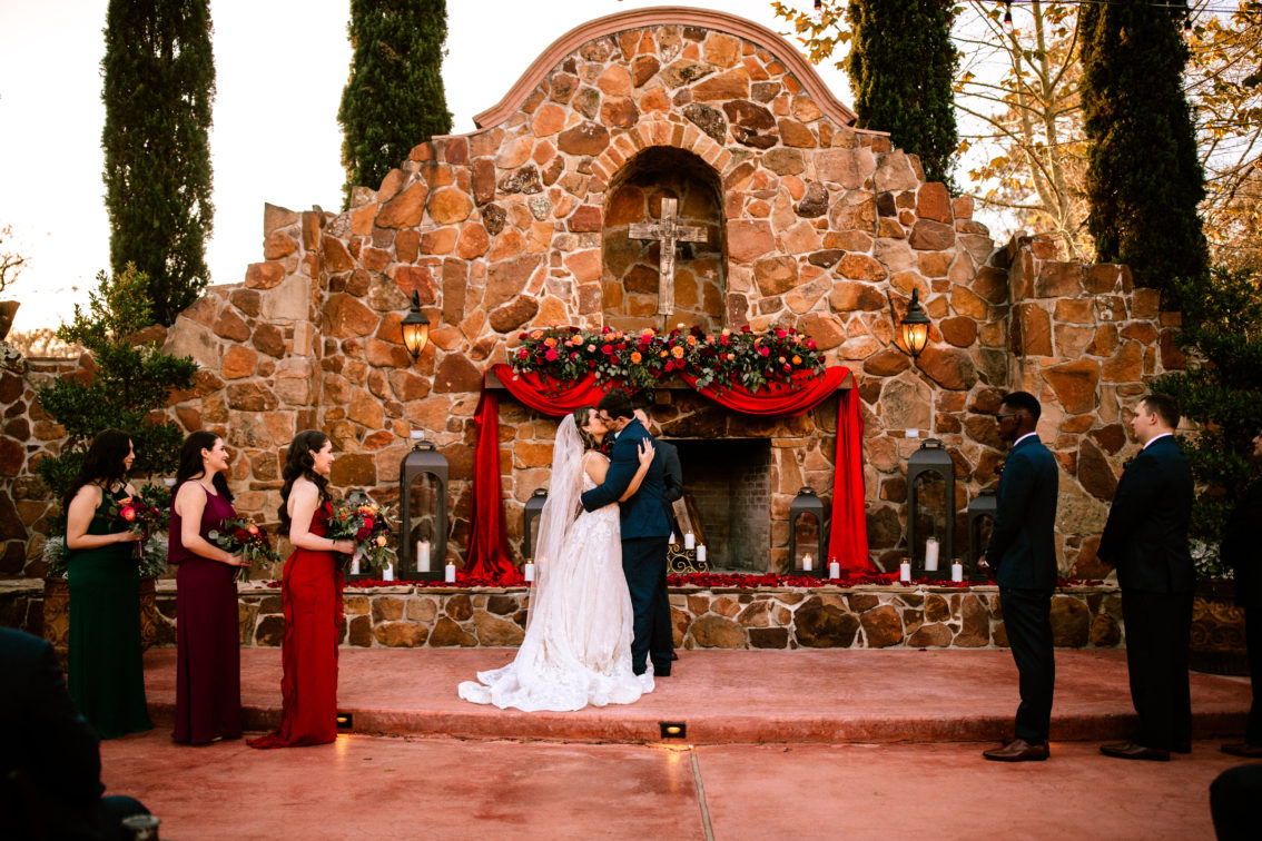 Outdoor ceremony near grand fireplace at Madera Estates